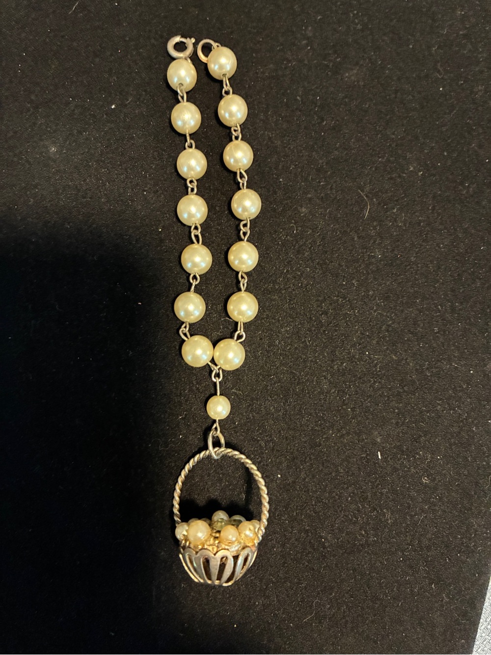 Pearl bracelet with basket charm dangle
